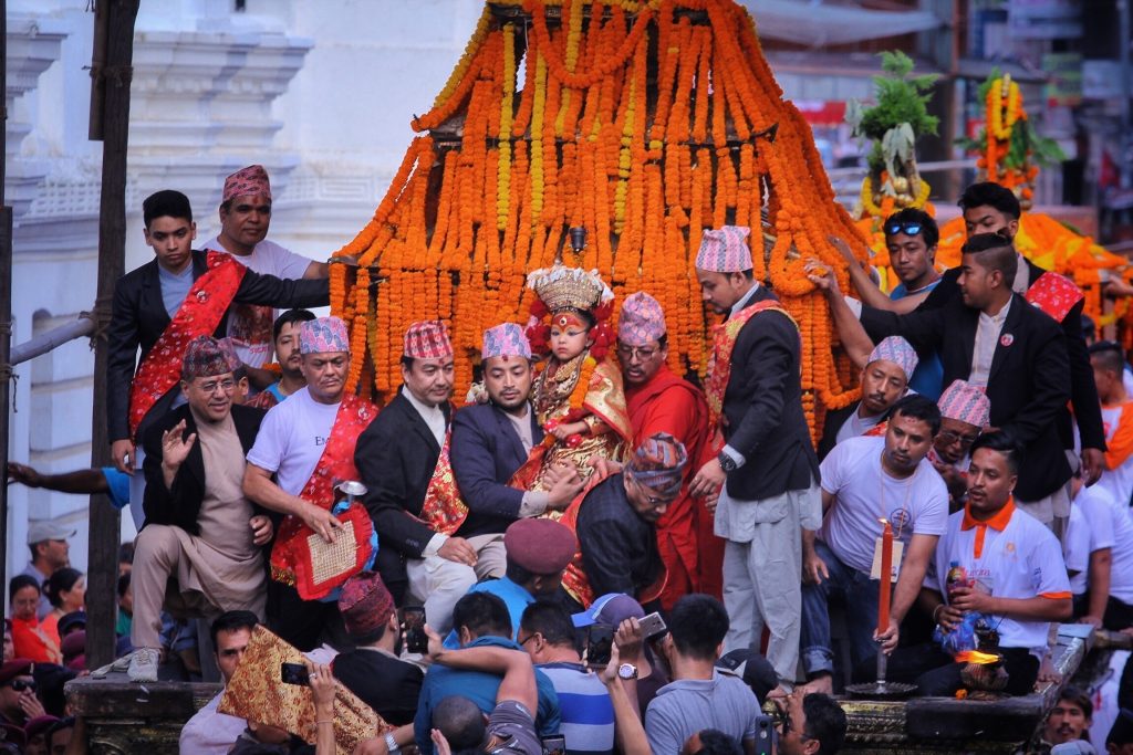 Crowds watching a traditional Newari Jatra chariot procession through the streets of Kathmandu Valley