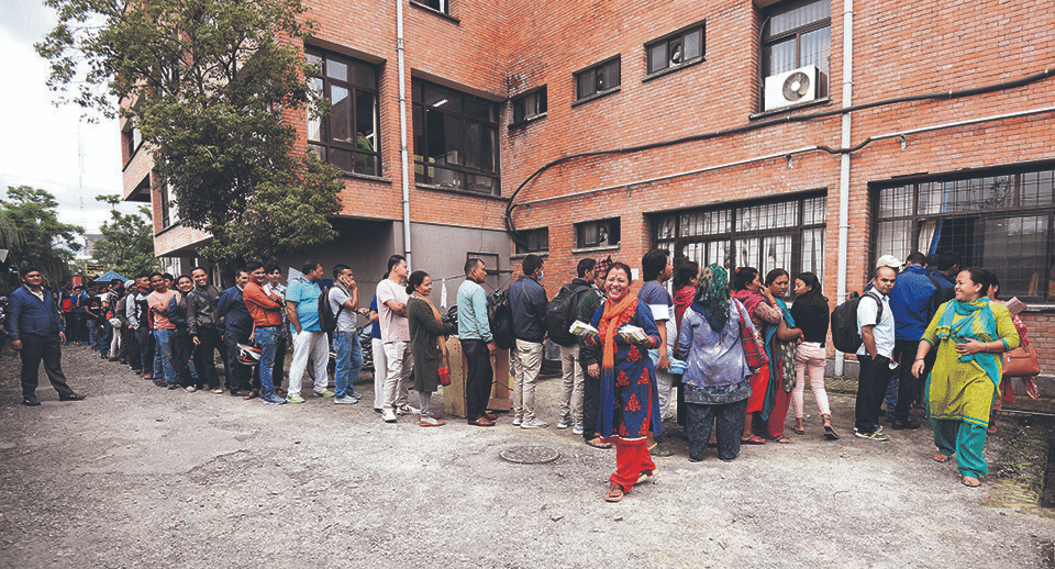 Queue outside a bank branch in Kathmandu in the days before Dashain holidays begin