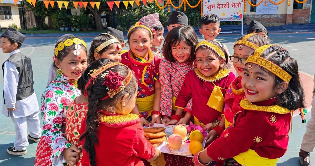 Children's bhailo group counting collected notes on a doorstep during Tihar evening