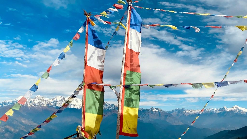 Prayer flags being strung over a stupa during a Lhosar morning in Kathmandu