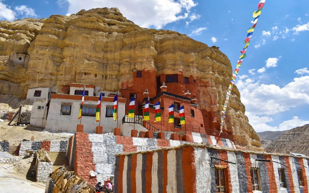 Walled town of Lo Manthang on the dry Mustang plateau with eroded cliffs behind